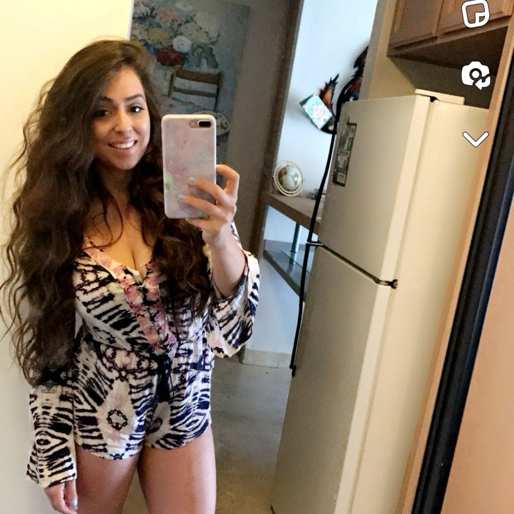 Light multicolored long sleeve romper perfect for spring!